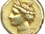 gros plan d'une pièce d'or portant un visage de femme