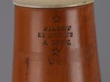 a brown vase with a star on the top of it