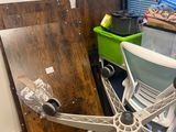 an image of a room with a desk and a chair