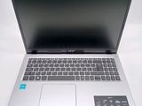 a laptop computer sitting on a table with a keyboard
