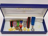 a blue box with medals and medals in it
