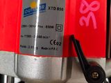 a close up of a machine with a red label on it