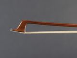 a close up of a violin bow with a wooden handle