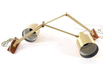 pair of brass and black lamps on a white background