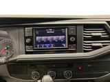 a car dashboard with a radio and a steering wheel