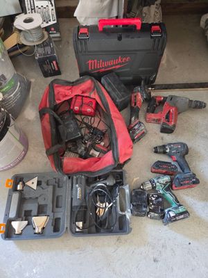 many tools that are sitting on the floor in the garage