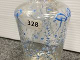 a close up of a glass bottle with a number on it