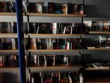 many books on the shelves in the room