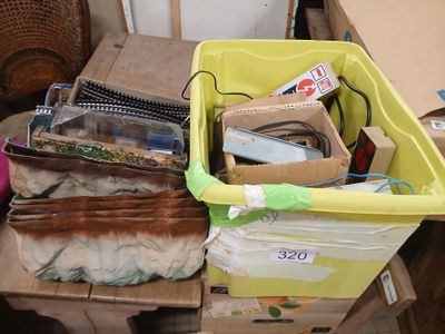 a yellow bin filled with assorted items sitting on a table