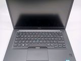 a laptop with a keyboard on it sitting on a table