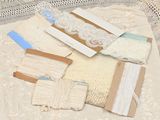 many different types of lace on a table cloth