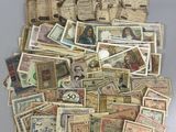 a pile of old paper money sitting on a table