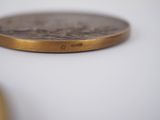 a small coin sitting on top of a white table