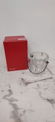 a red box and a silver bowl on a marble table
