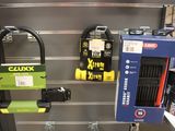 many different types of locks on the wall in the store
