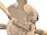 a wooden toy of a man holding a baseball bat