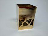 a small metal box with a pair of scissors in it