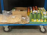 a cart with a lot of food and drinks on it