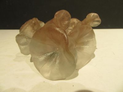 a glass figurine that is sitting on a table