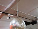 a disco ball hanging from the ceiling of a building