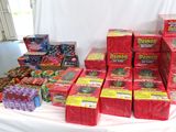 many boxes of candy on a table with a white cloth