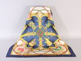 an image of a blue and yellow scarf with a cross on it