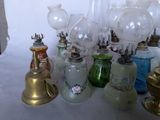 many different types of glass vases and lamps on the table
