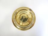 a gold plate with a picture of a man on it