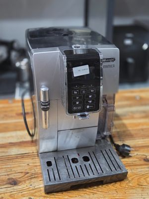 an image of a coffee machine on a wooden table