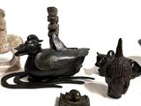 a lot of figurines that are sitting on a table