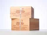 three wooden boxes stacked on top of each other on a table
