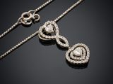une paire de colliers en or blanc et diamants