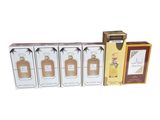 three boxes of perfume and a box of perfume on a white background