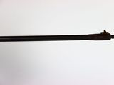 a gun that is sitting on top of a table