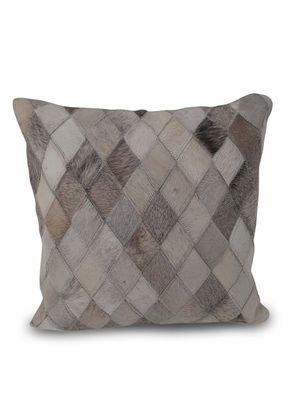 un coussin marron et blanc sur un fond blanc
