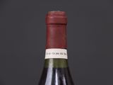 a bottle of wine that is sitting on a table