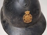 a helmet with a badge on it sitting on a table