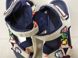 a pair of children ' s shoes that are on a white surface