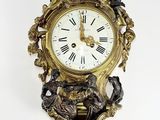 a clock that is hanging on the wall on the wall