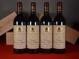 three bottles of red wine sitting on a table next to a wooden box