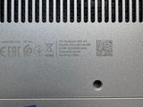 a close up of a metal surface with a small logo on it