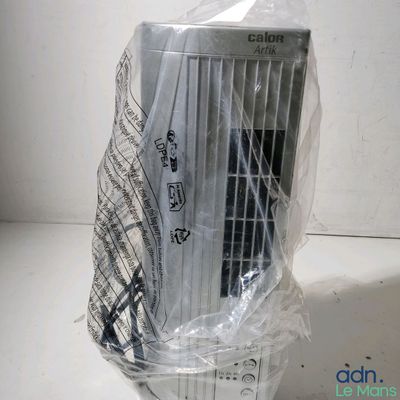 a small air conditioner wrapped in plastic on a table