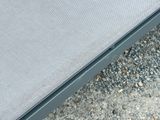 a close up of a bench with a cushion on top of it