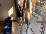 two mannequins that are standing in front of a window