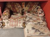 a couch that has a lot of pillows on it