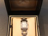 a box with a watch inside of it on a table