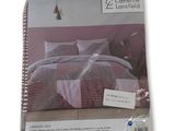la couette se trouve dans l'emballage du lit