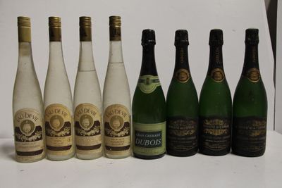 several bottles of wine are lined up in a row on a table