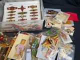 a lot of assorted pins and brooches on a table