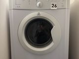 a washer and dryer in a small room